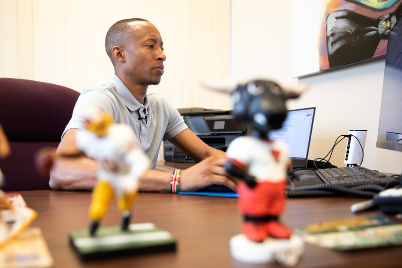 Clark shows his Maverick pride on his desk, with an "O" pin and a Durango bobblehead