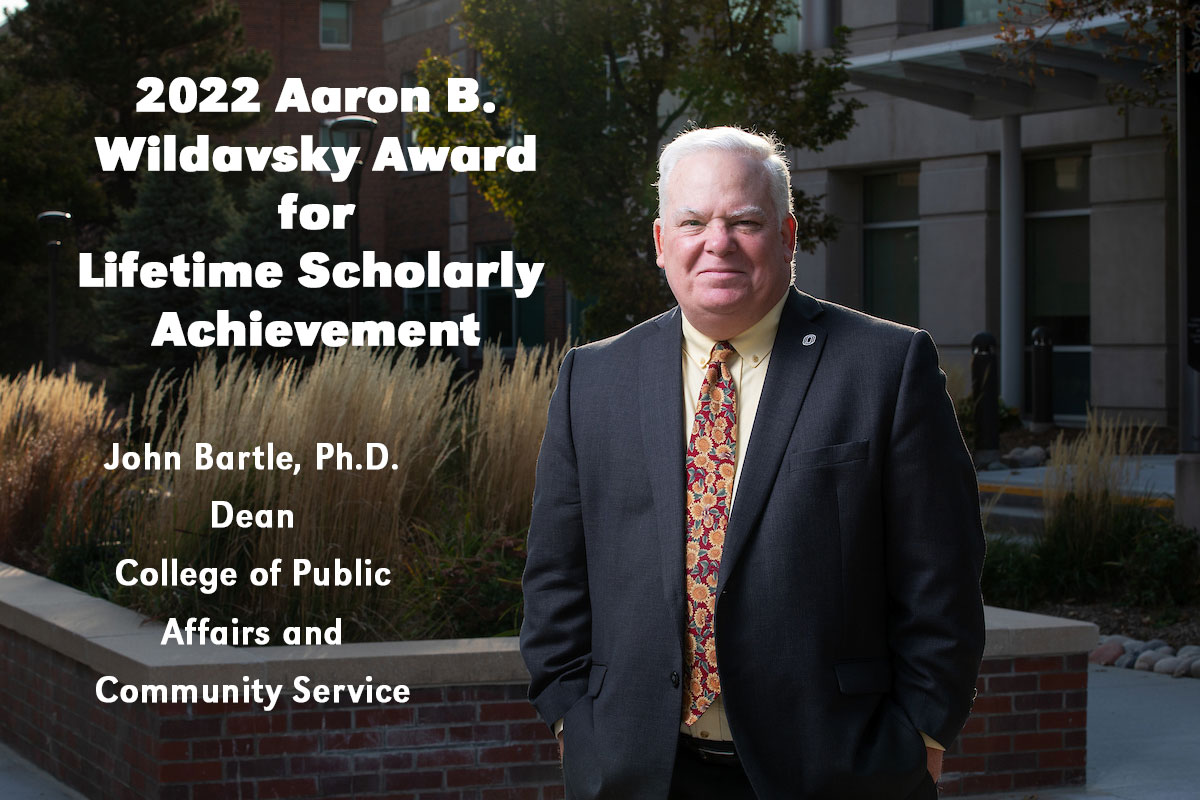 John Bartle with text "2022 Aaron B. Wildavsky Award for Lifetime Academic Achievement"