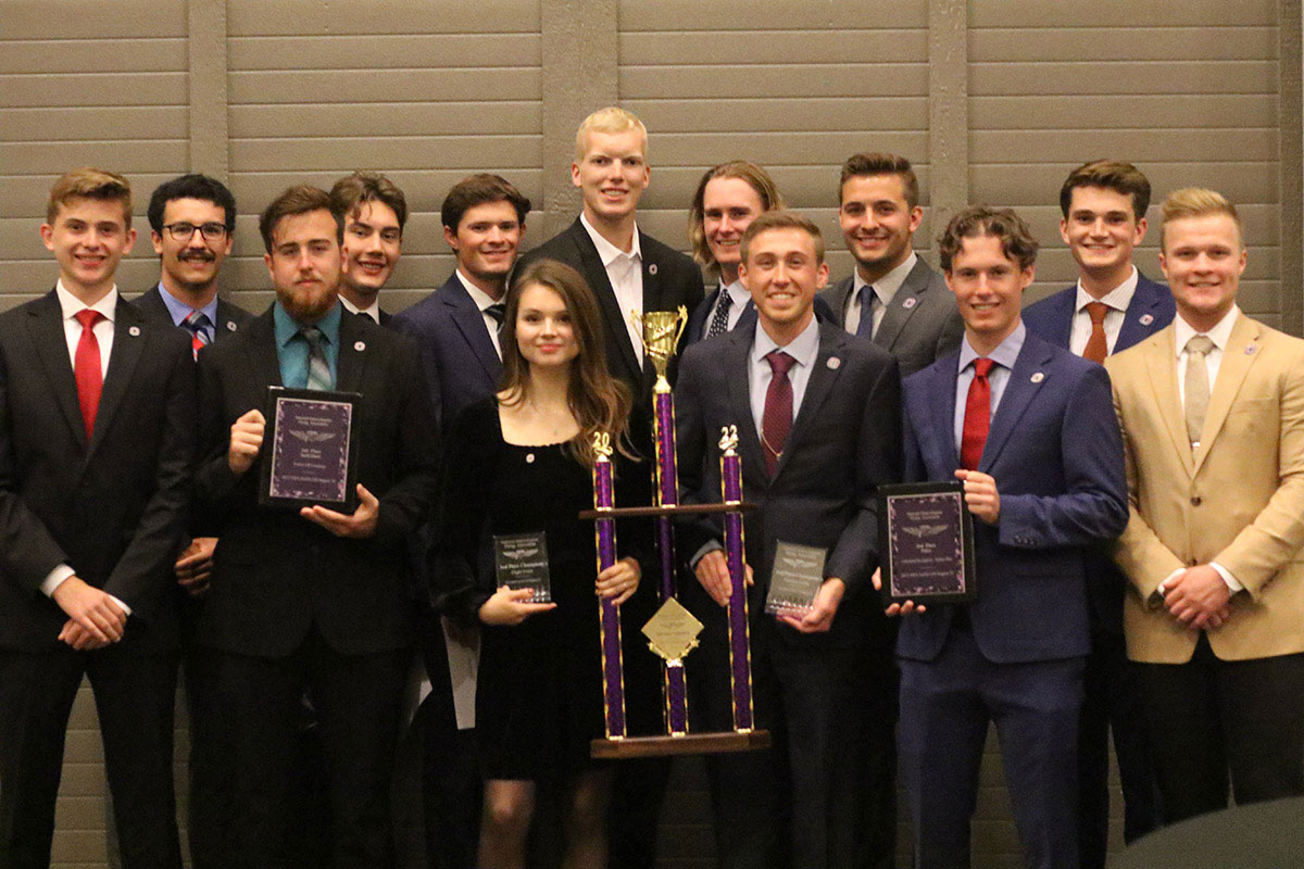 2022 Regional UNO Flight Team. From left to right: Kaleb Kroeger, Kenny Thomason, Tyler Haney, David Wellnitz, Jonathan Corey, Kennedy Sibbitt, Tomas Kathol, Tristan Weston, Hunter Pehrson, Garrett Ferguson, Cullen Leitner, Owen Brennan, and Tyler Craft.