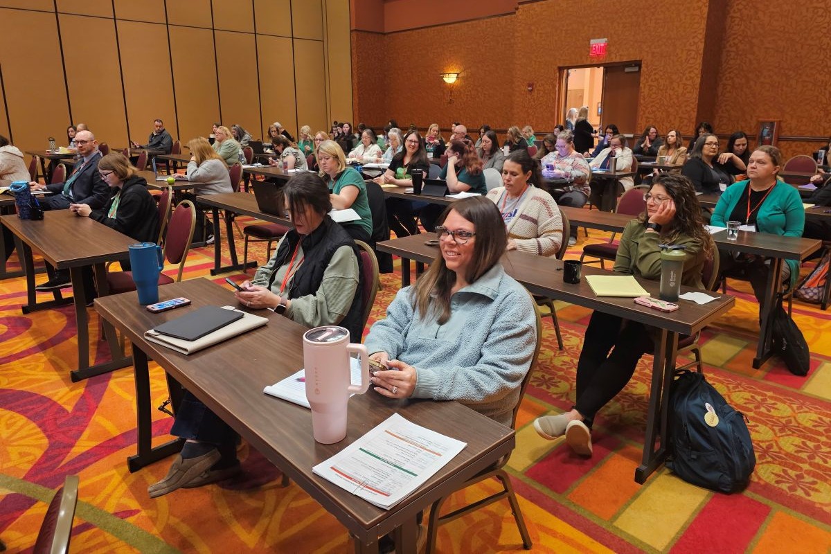 Group of clerks sitting in a classroom.