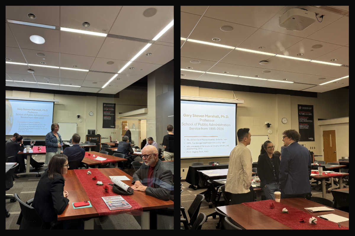 Group of people sitting and standing around decorated tables.