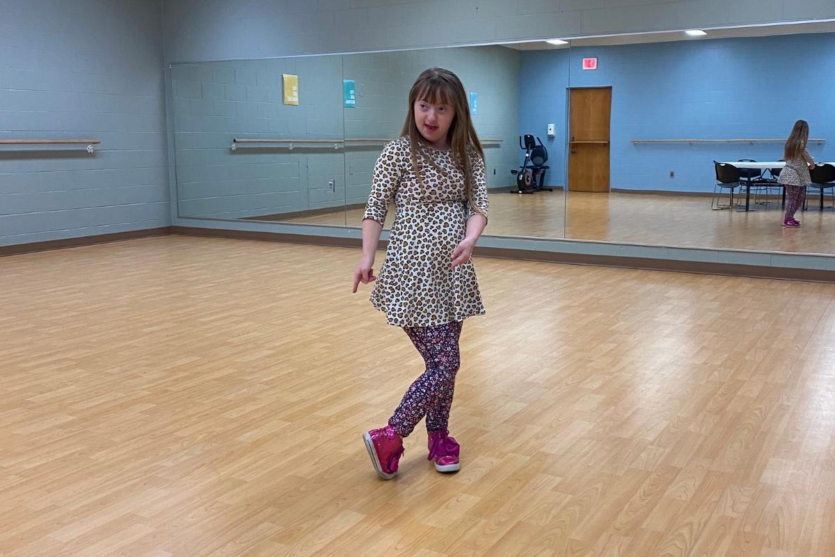 Woman dancing on dance floor.