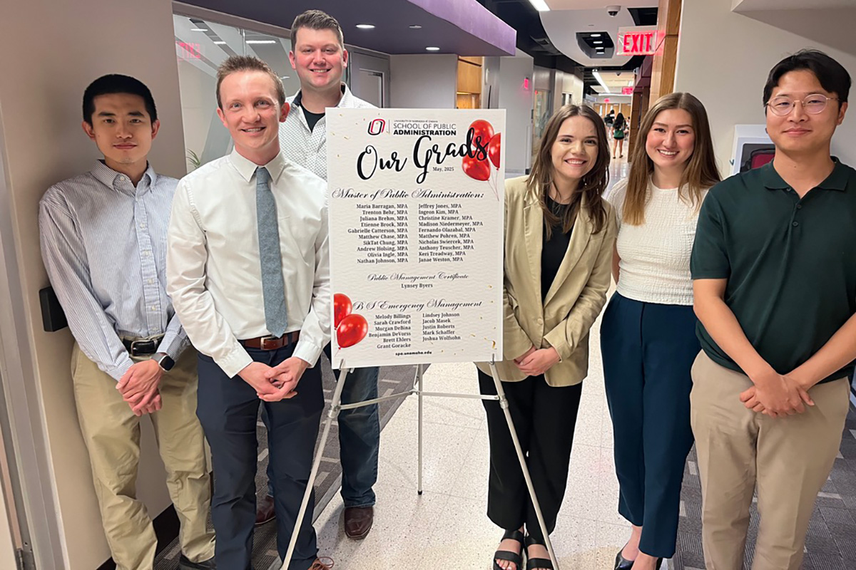 mpa students standing in hallway after presenting projects