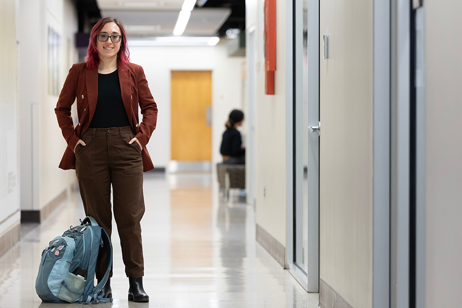 Students in building with backpack