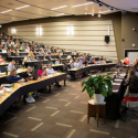 students in large lecture hall.