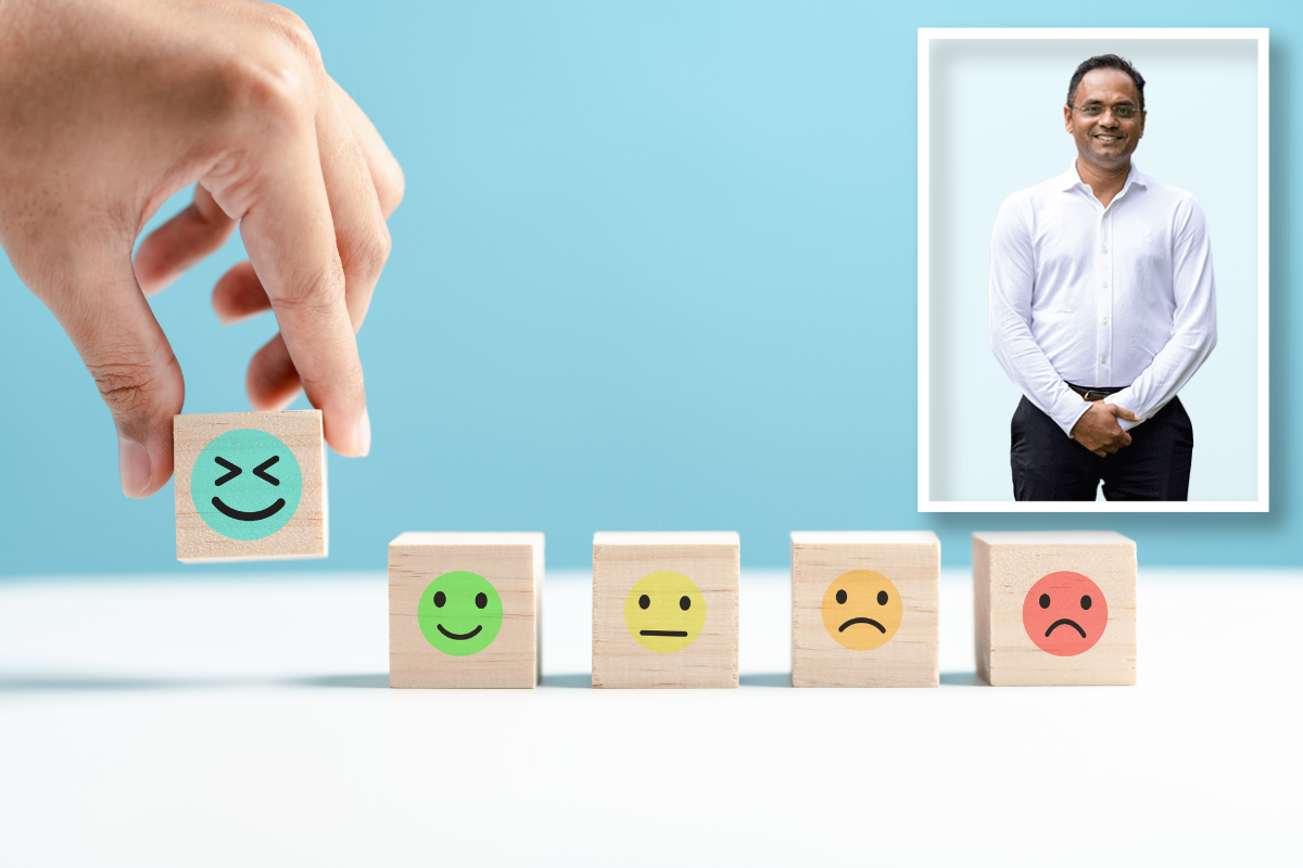 Five wooden blocks each with a different emotion painted on it.