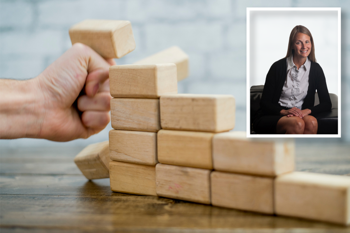 Fist pushing over wooden blocks.