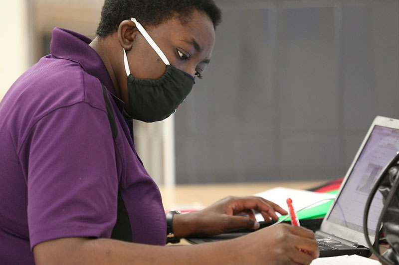 Student pictured who is working in a service learning class.