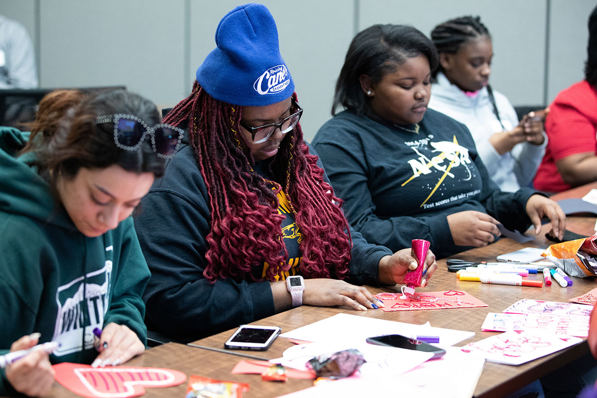 Volunteers make Valentine's Day cards for veterans during the University of Nebraska at Omaha's Martin Luther King Jr. Day of Service in Omaha, Nebraska at the Barbara Weitz Community Engagement Center.