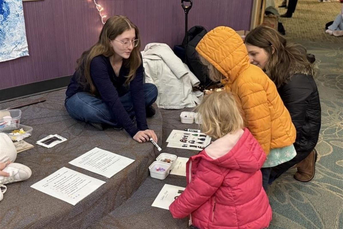 Image of UNO students working with youth in a P-16 course.