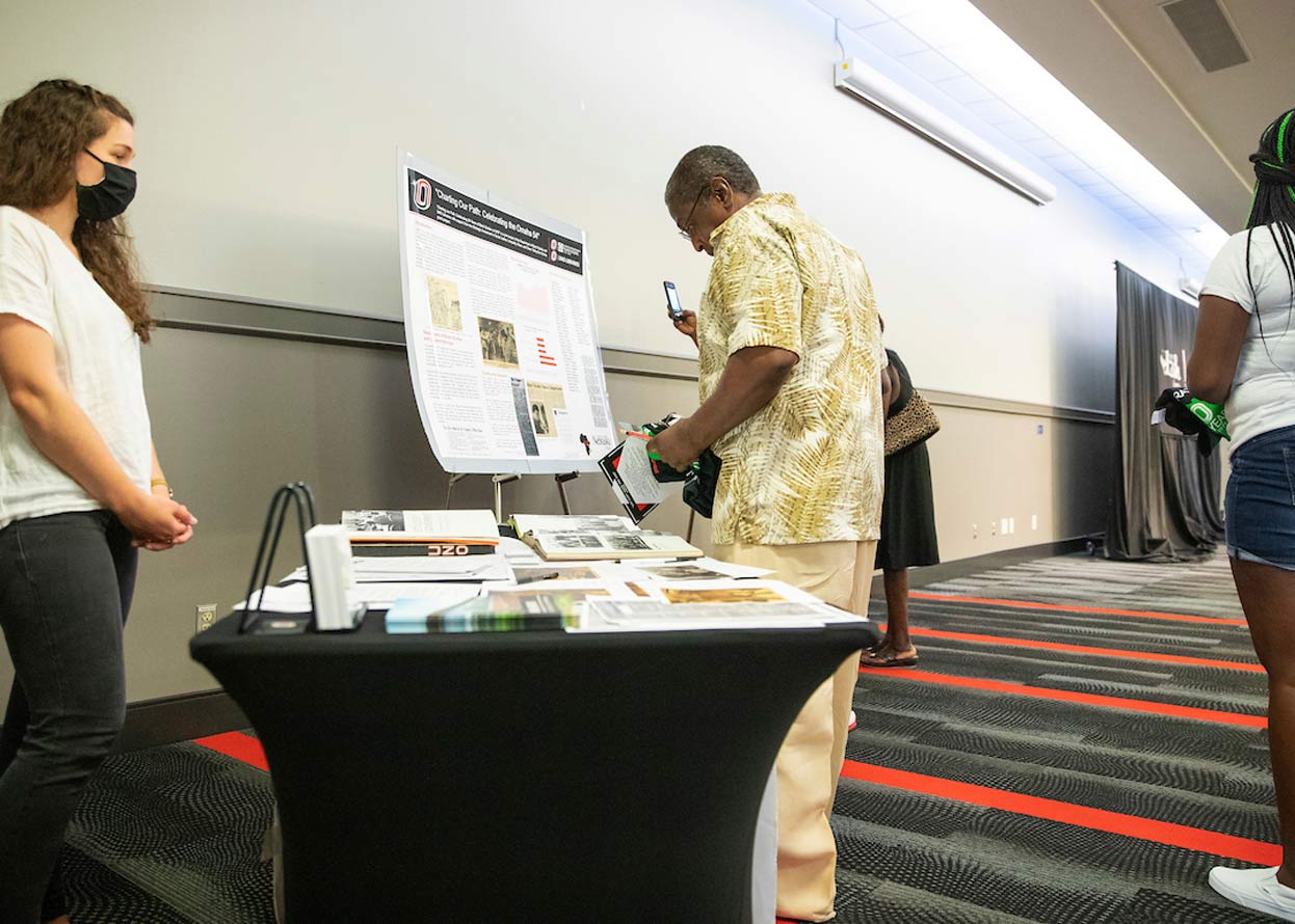 an information table with people looking at it