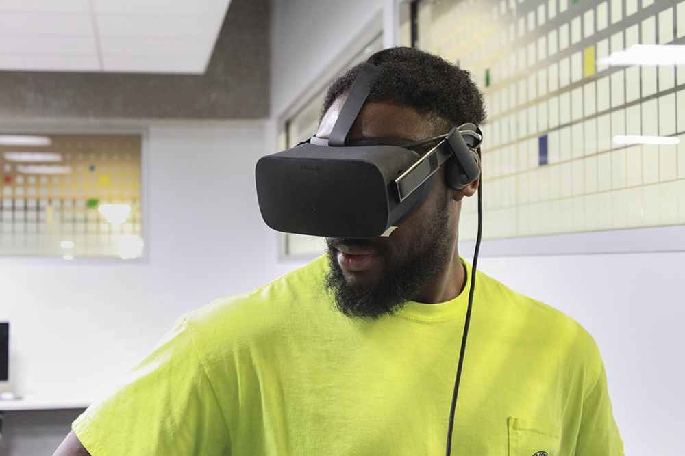 Man wearing Oculus Rift VR headset.