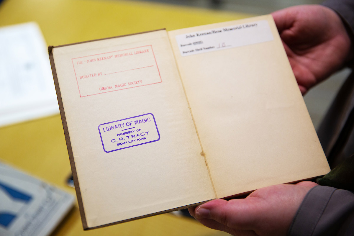 open book with stamp on inside cover 