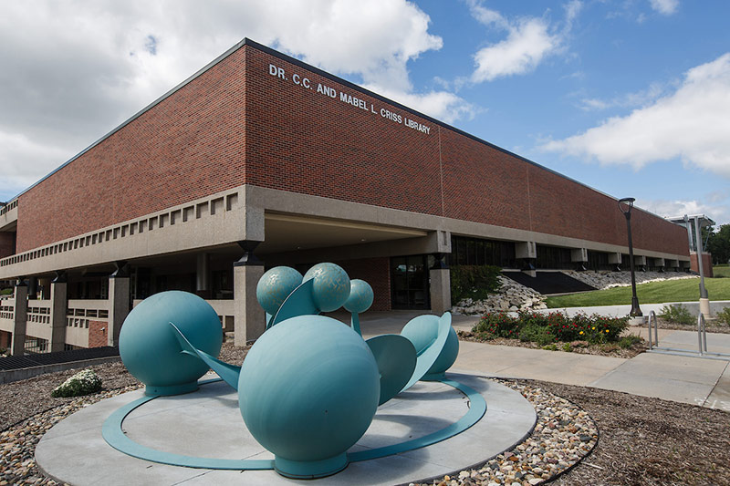 Exterior of Criss Library building with atoms sculpture