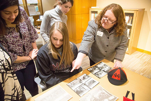 UNO students looking at archival materials