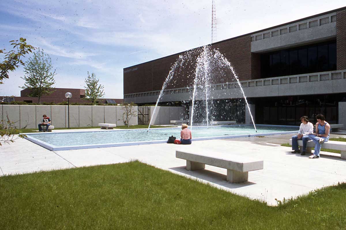 An exterior photo of the Criss Library with a now-removed fountain and outdoor seating.