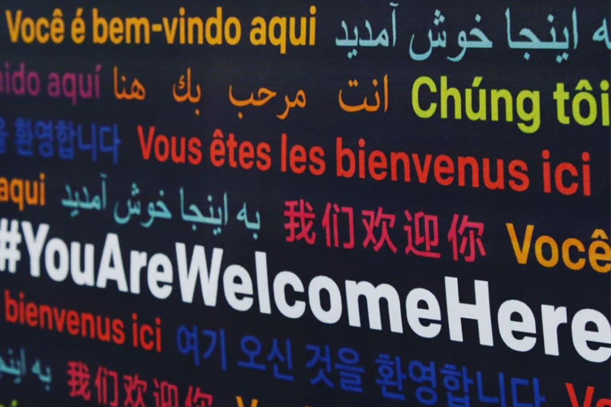 black page with the phrase 'you are welcome' in different colors and languages 