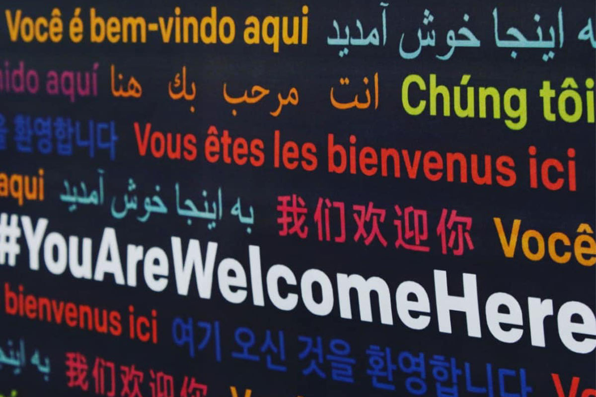 black page with the phrase 'you are welcome' in different colors and languages