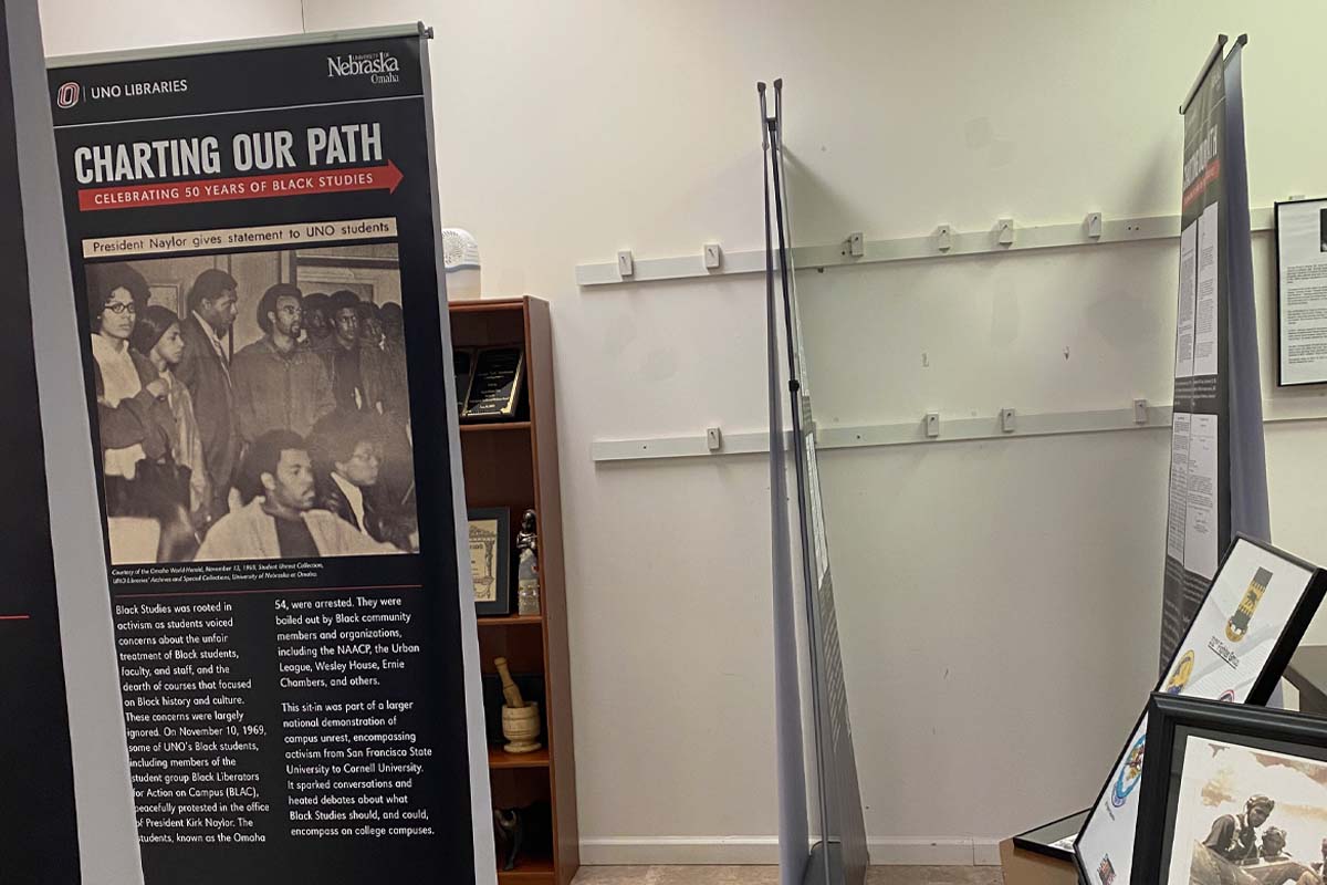 standing poster with words and archival photos on it, all associated with the Department of Black Studies