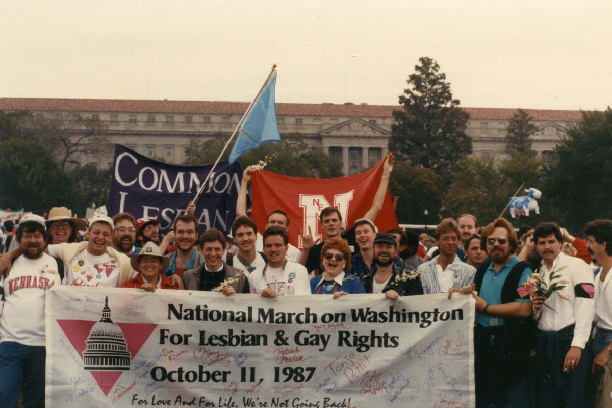 1. A group of Nebraskans holding an autographed banner at the Second National March on Washington for Lesbian and Gay Rights in Washington, D.C.