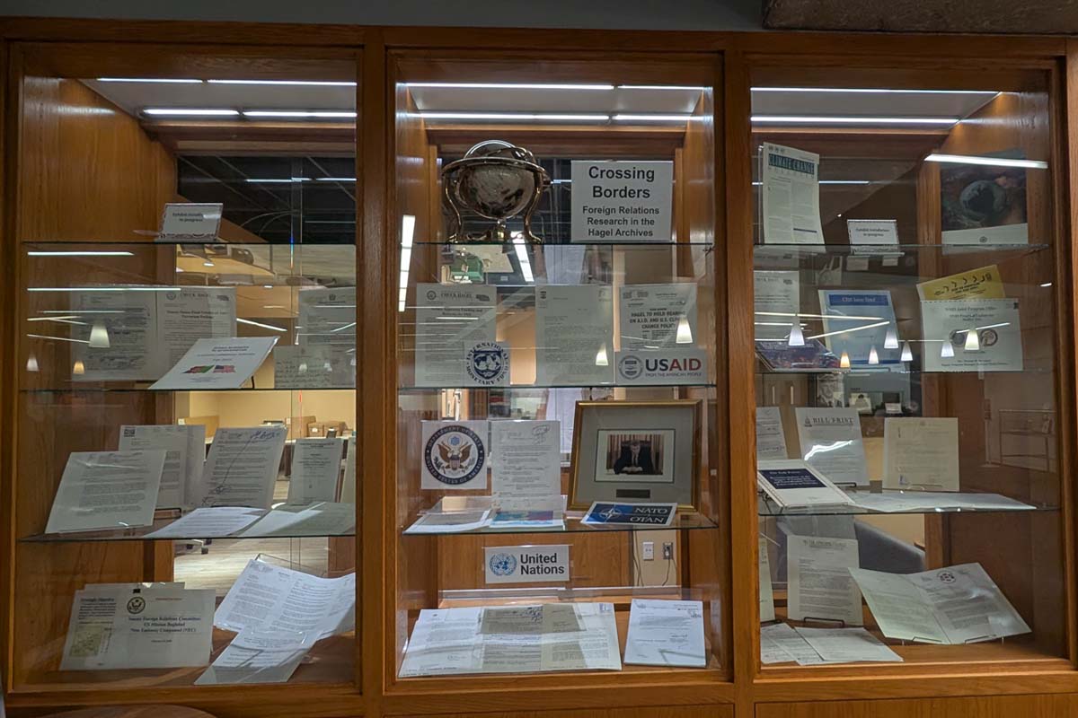 Built in wooden display shelves with documents and artifacts related to Chuck Hagel and foreign relations from 1997-2008.