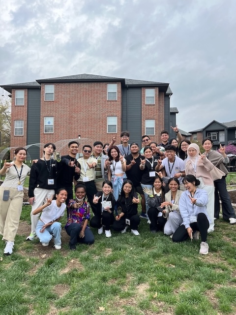YSEALI Fellows Pose for a Group Photo in front of the housing community gardens