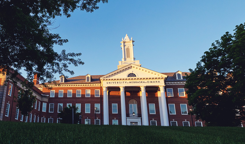 UNO's Arts and Sciences Hall exterior at sunrise.