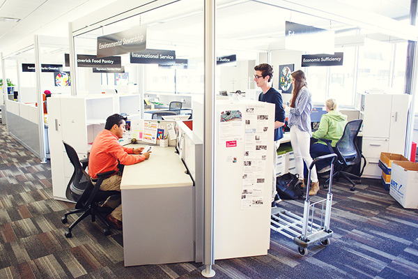 People work and study in shared spaces inside the Community Engagement Center.