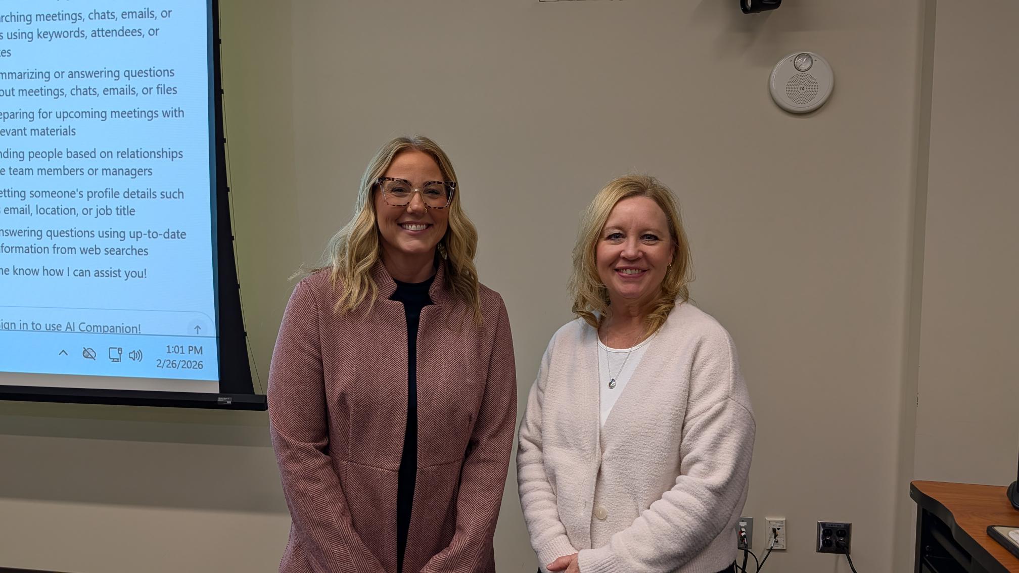 Presenter Ciara Warden and Wellness Committee Chair Lisa Epp stand side by side and smile at the camera.