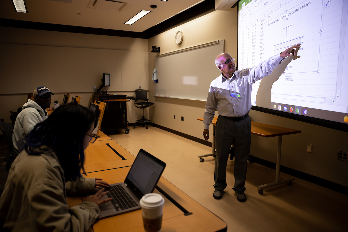 Henry D'Souza instructing class