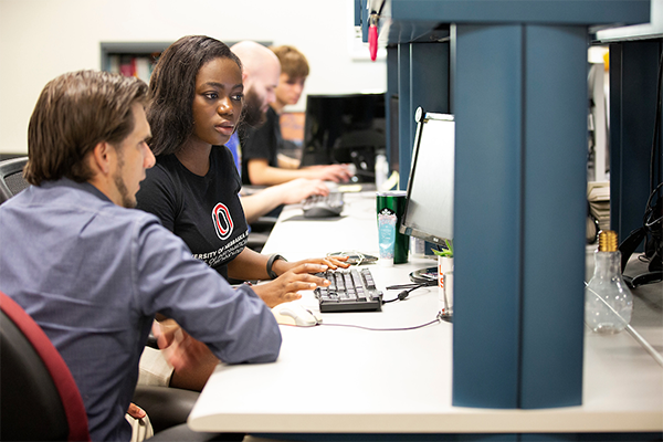 IS&T Attic manager Zac Fowler helps UNO junior Sobie Don, a management information systems major who works as a student developer and project manager, in the Peter Kiewit Institute at the University of Nebraska at Omaha in Omaha, Nebraska, Tuesday, July 23, 2019.