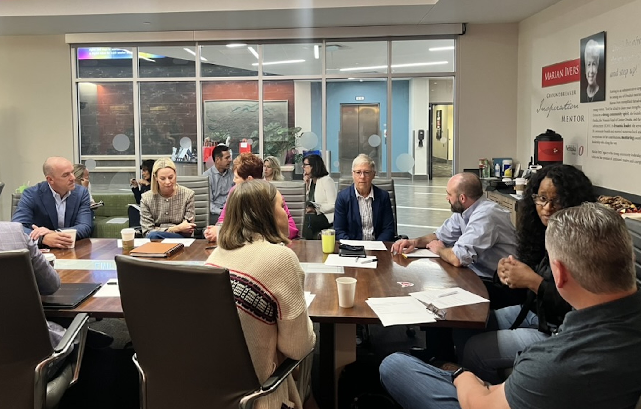Graphic logo with the letters “CBE” in bold white text on a black background, underlined in red.