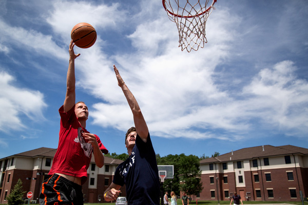 students playing basketball