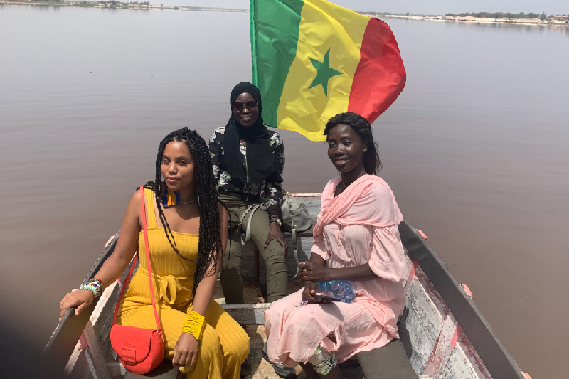 Dombeck and friends with a Senegal flag on water