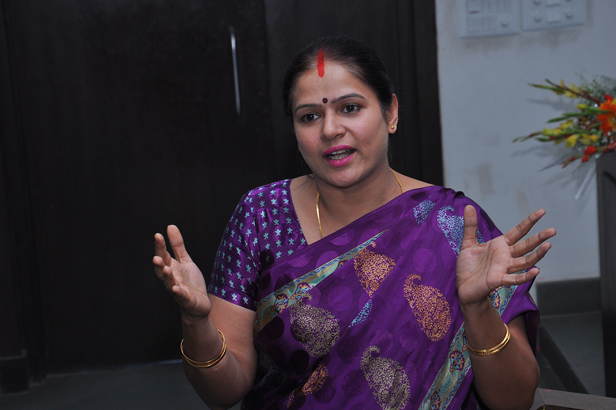 An Indian Professor addresses her classroom