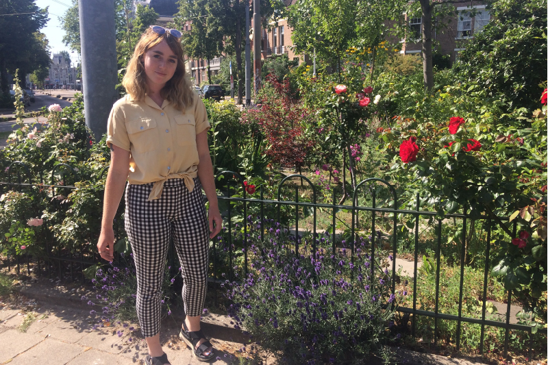 Hill standing in front of a garden