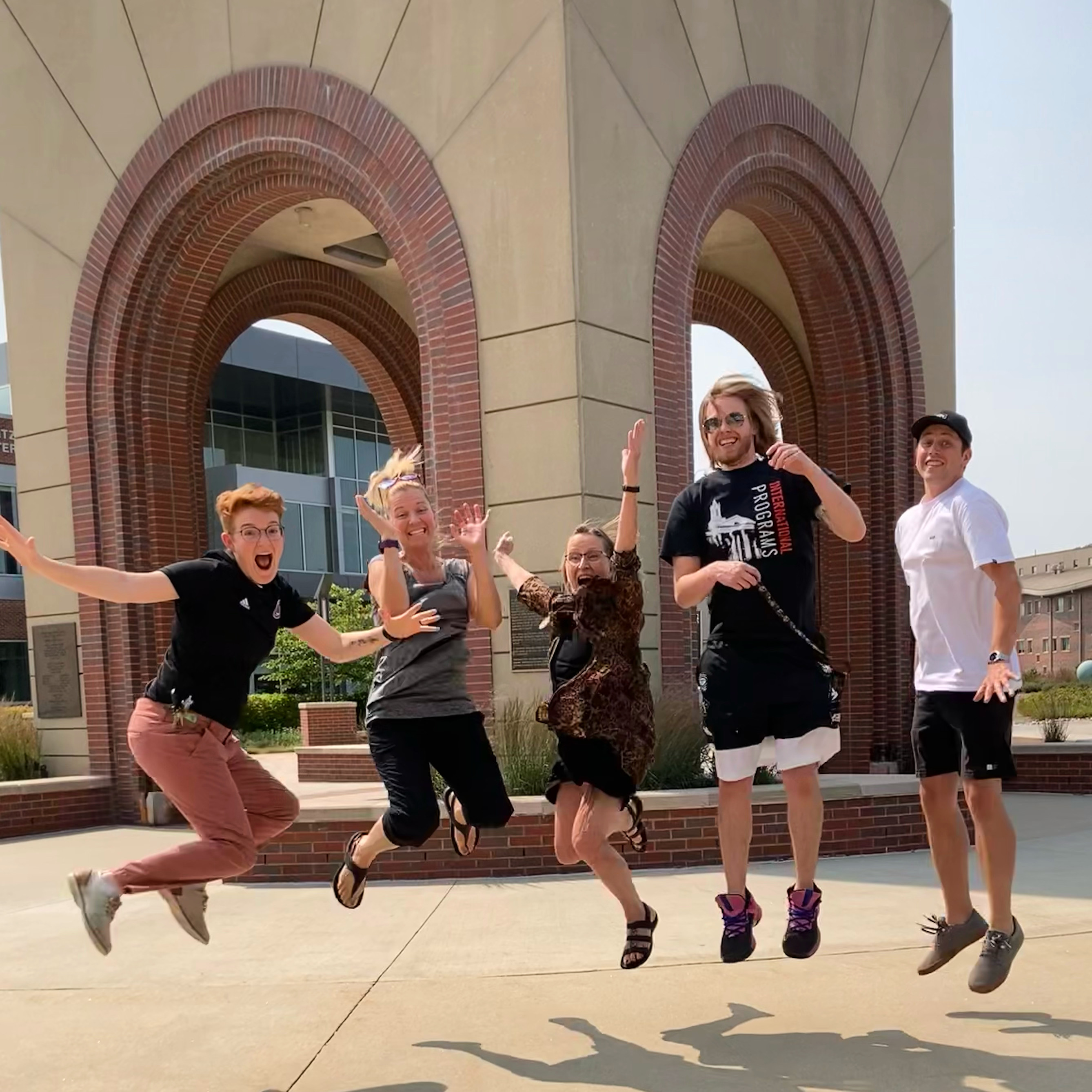 iluno staff and helpers outside campanile