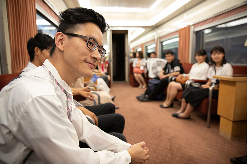 Japanese students tour Durham Museum train.