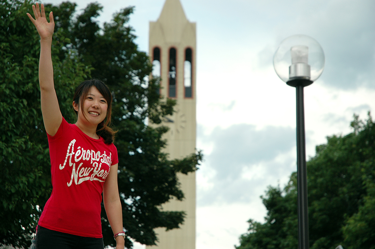 student-waving-bell-tower-small.jpg