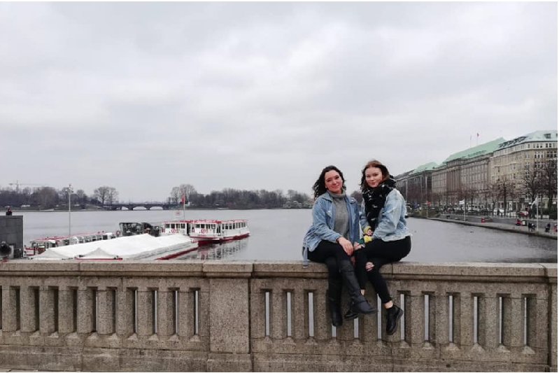 Kelsey Nekl sitting with a friend in Austria.