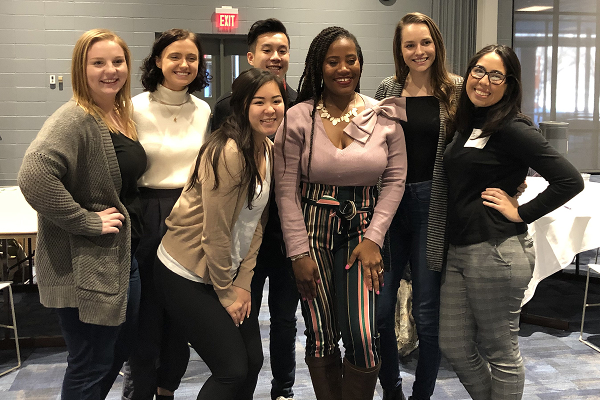 UNO students pose for a group photo with Lessons From Abroad keynote speaker, Deidre Mathis