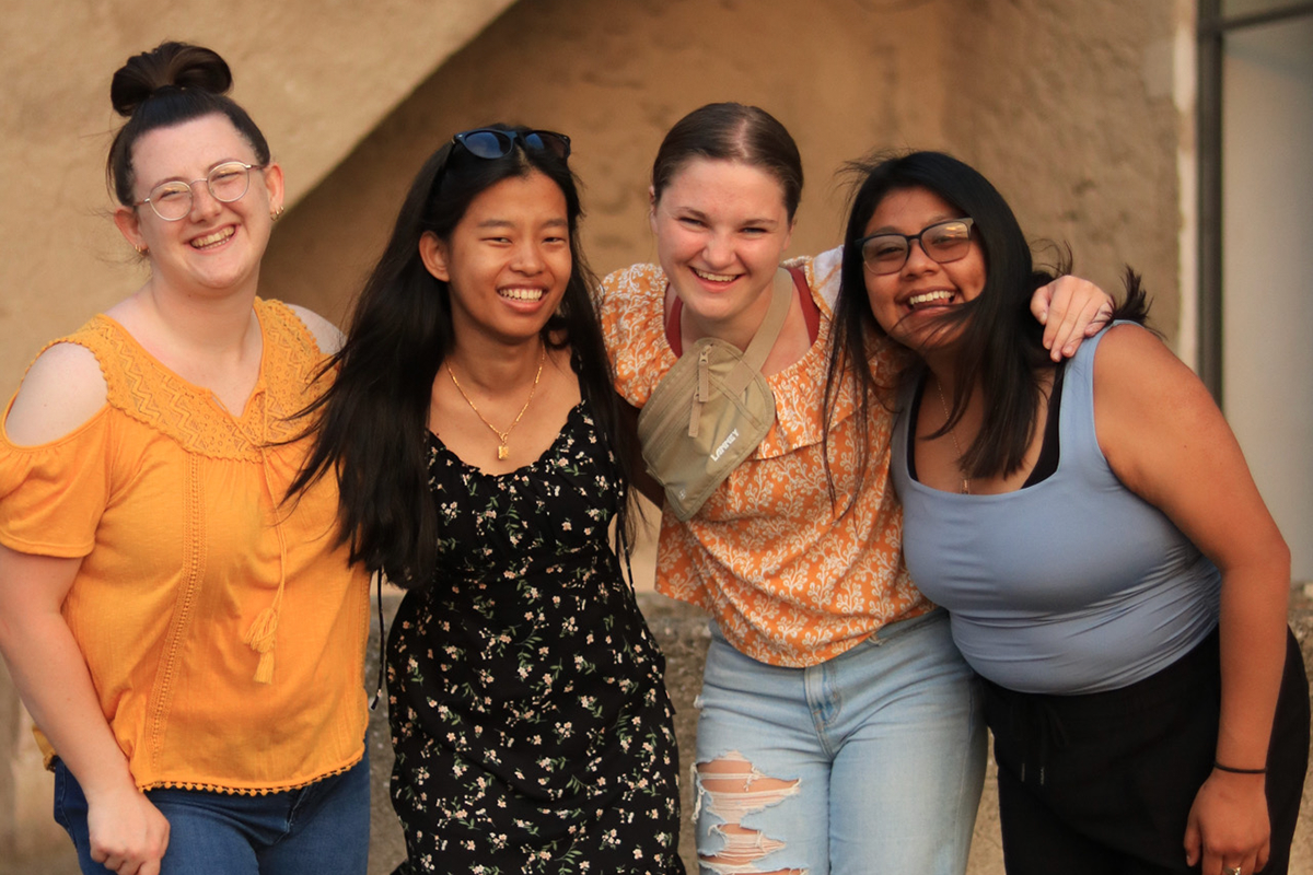 4 UNO students stand together for a photo in Italy