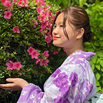Sa poses by a plant in Japan