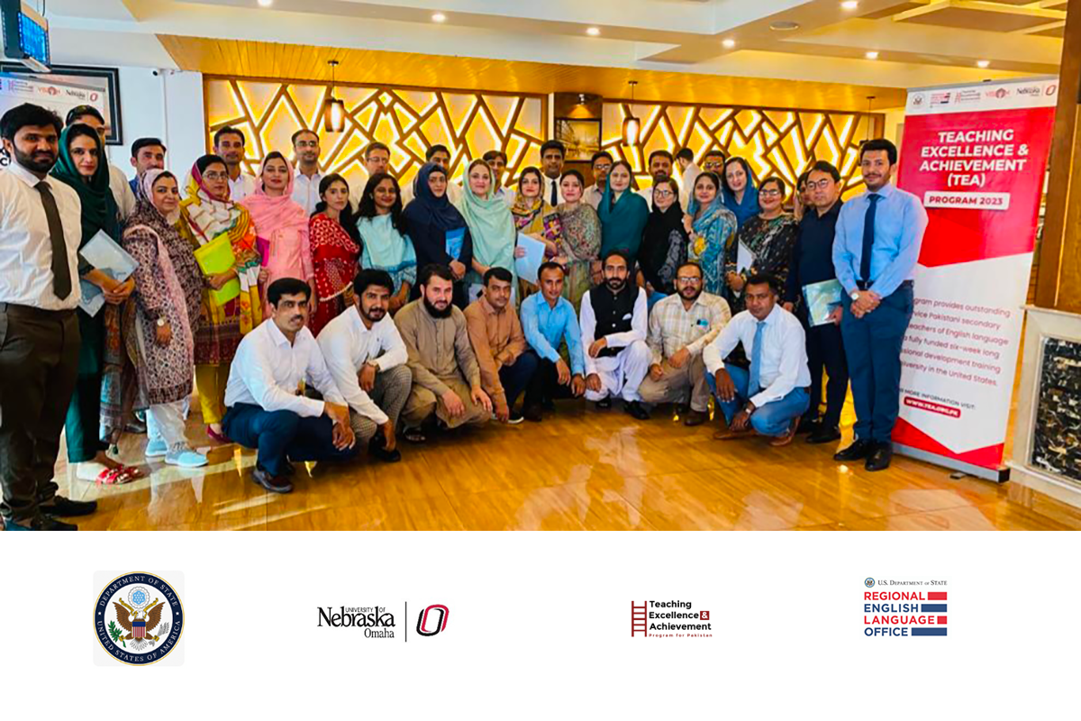 A group of Pakistani English teachers pose for a group photo.