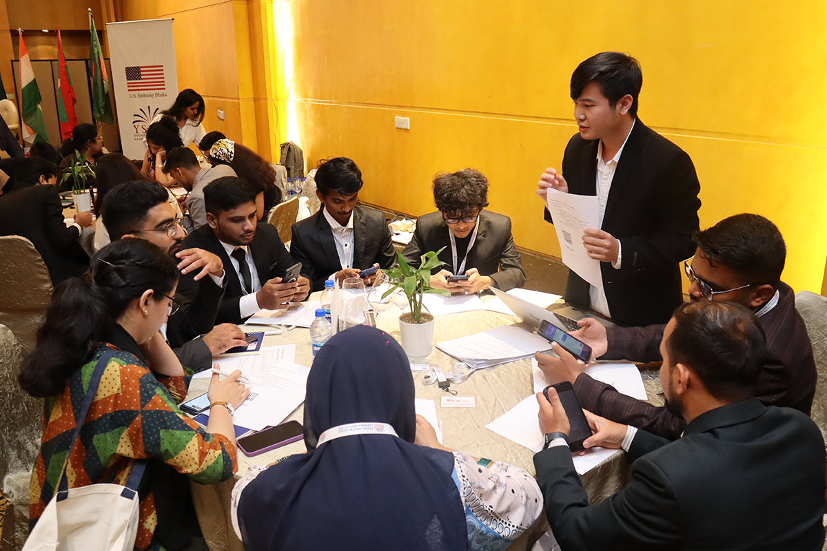 Group of people gathered around a table.