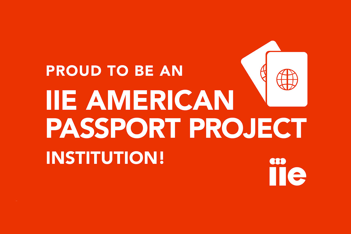 Red background with white passport graphic and the words: Proud to be an IIE American Passport Project Institution!