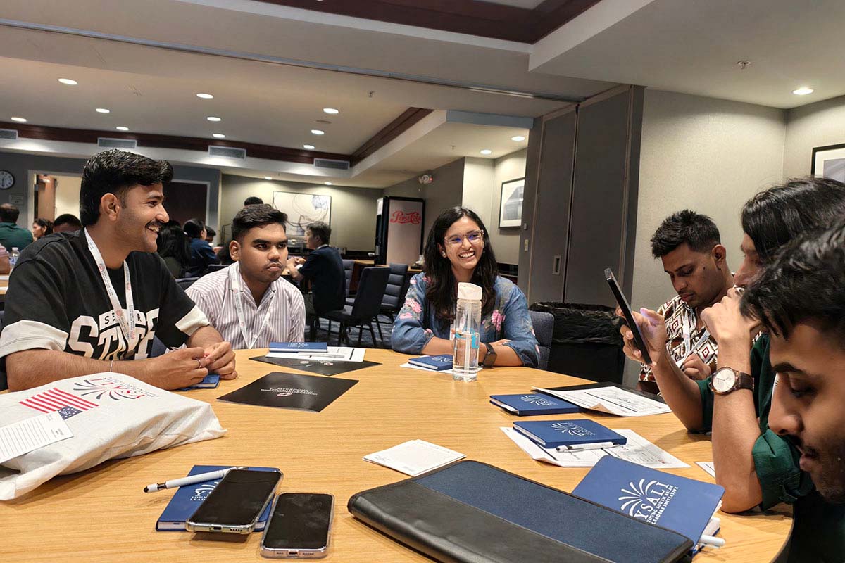 A group of participants networking and talking together