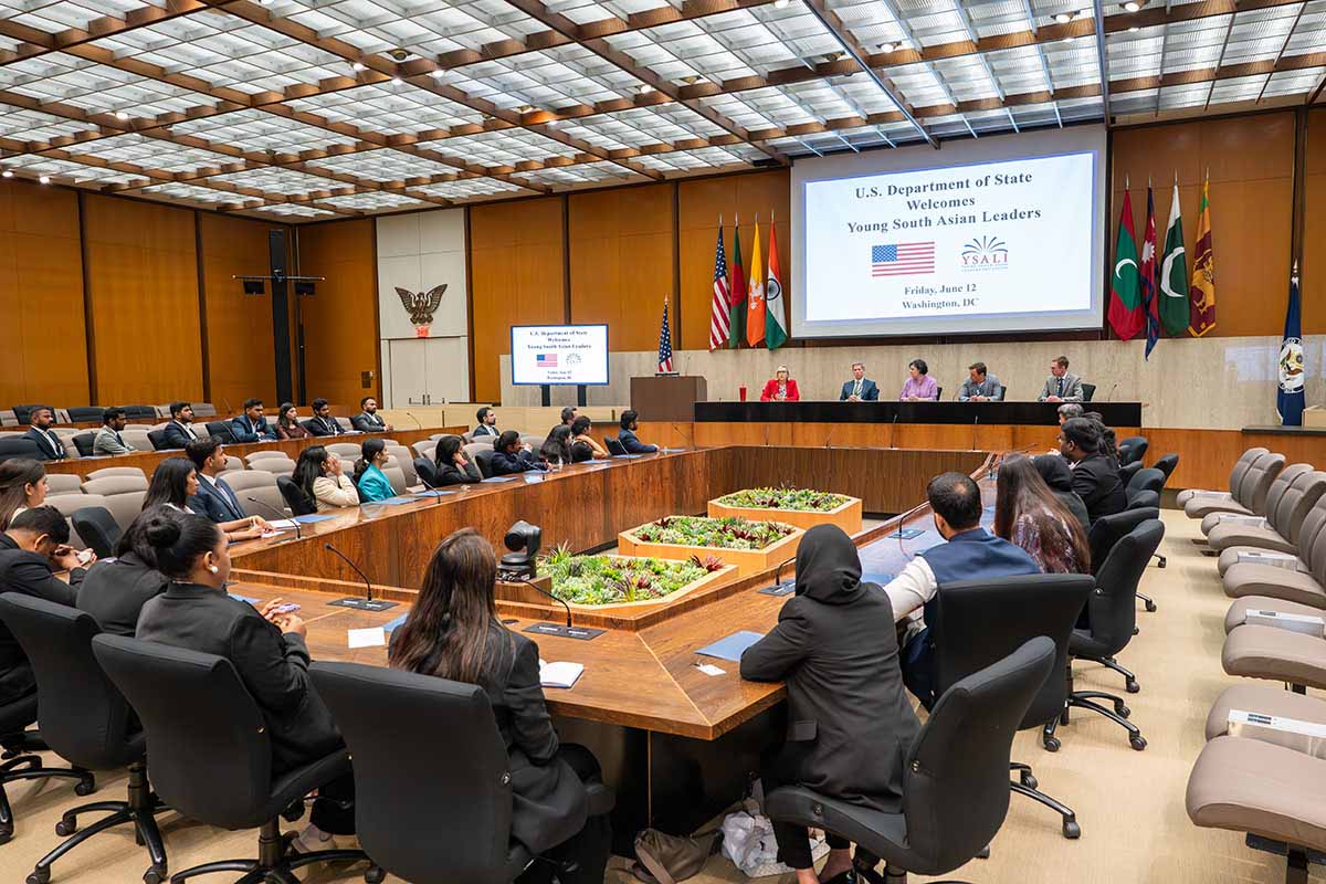 YSALI participants sit in a large board room with U.S. Department of State officials