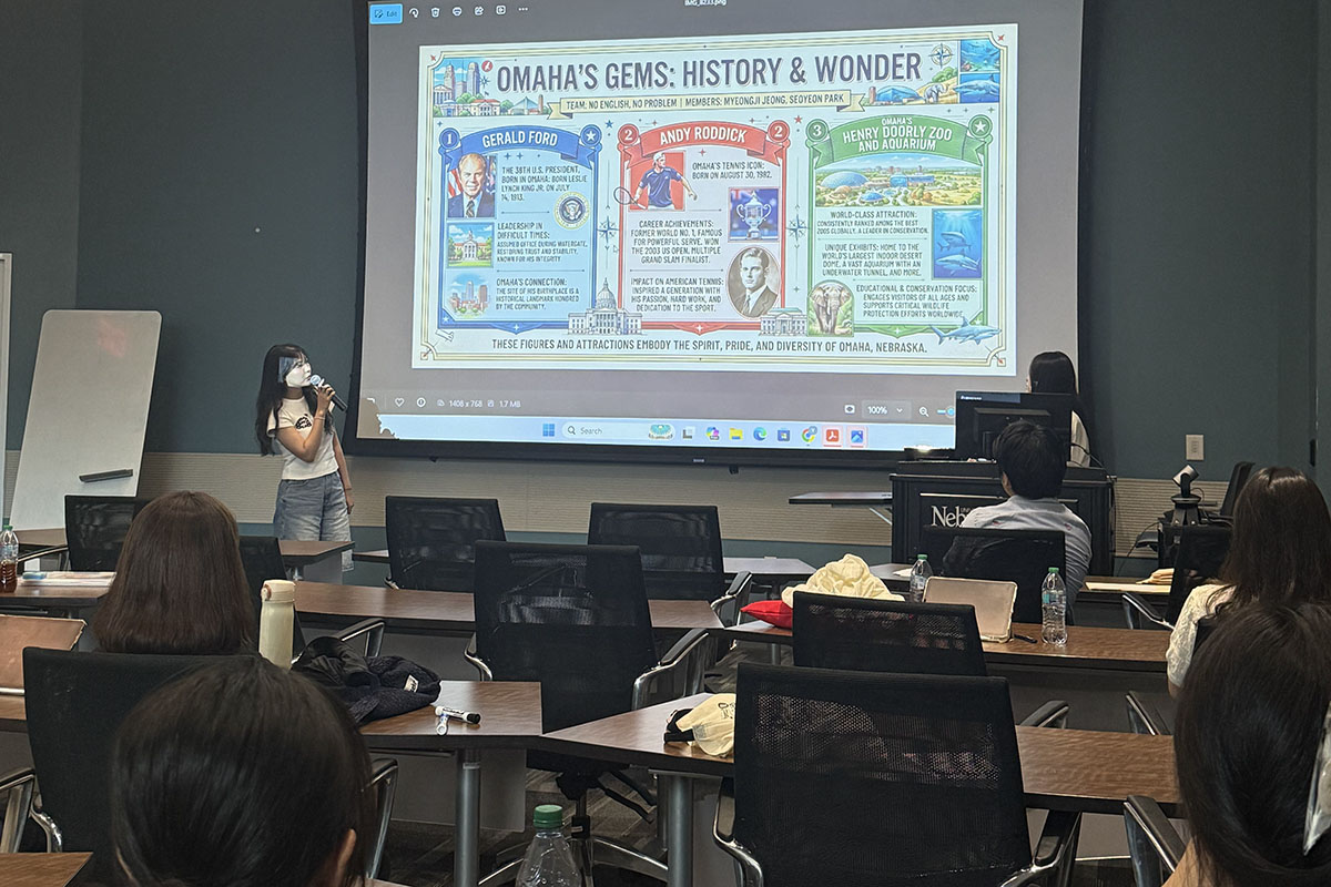A student presents her final presentation to her classmates