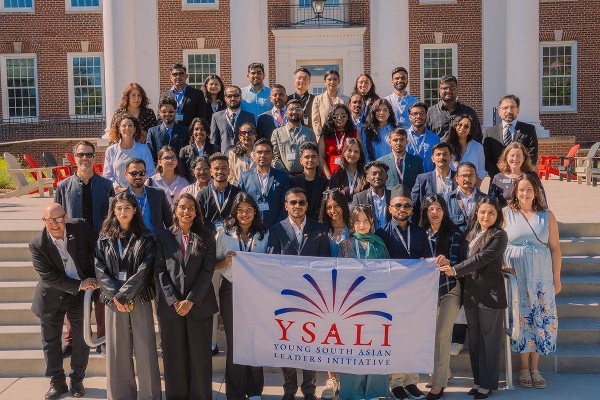 YSALI Cohort 2 poses for a photo in front of the Arts and Sciences Hall at University of Nebraska at Omaha.